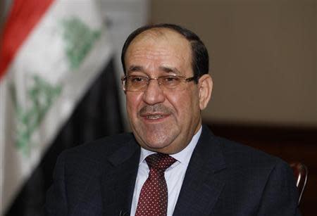 Iraq's Prime Minister Nuri al-Maliki speaks during an interview with Reuters in Baghdad January 12, 2014. REUTERS/Thaier Al-Sudani