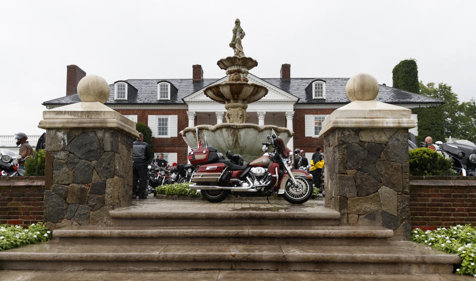 Motorcycles are parked in front of the clubhouse of the Trump National Golf Club in Bedminster, N.J., Saturday, Aug. 11, 2018, before President Donald Trump met with members of the Bikers for Trump group and supporters. (AP Photo/Carolyn Kaster)