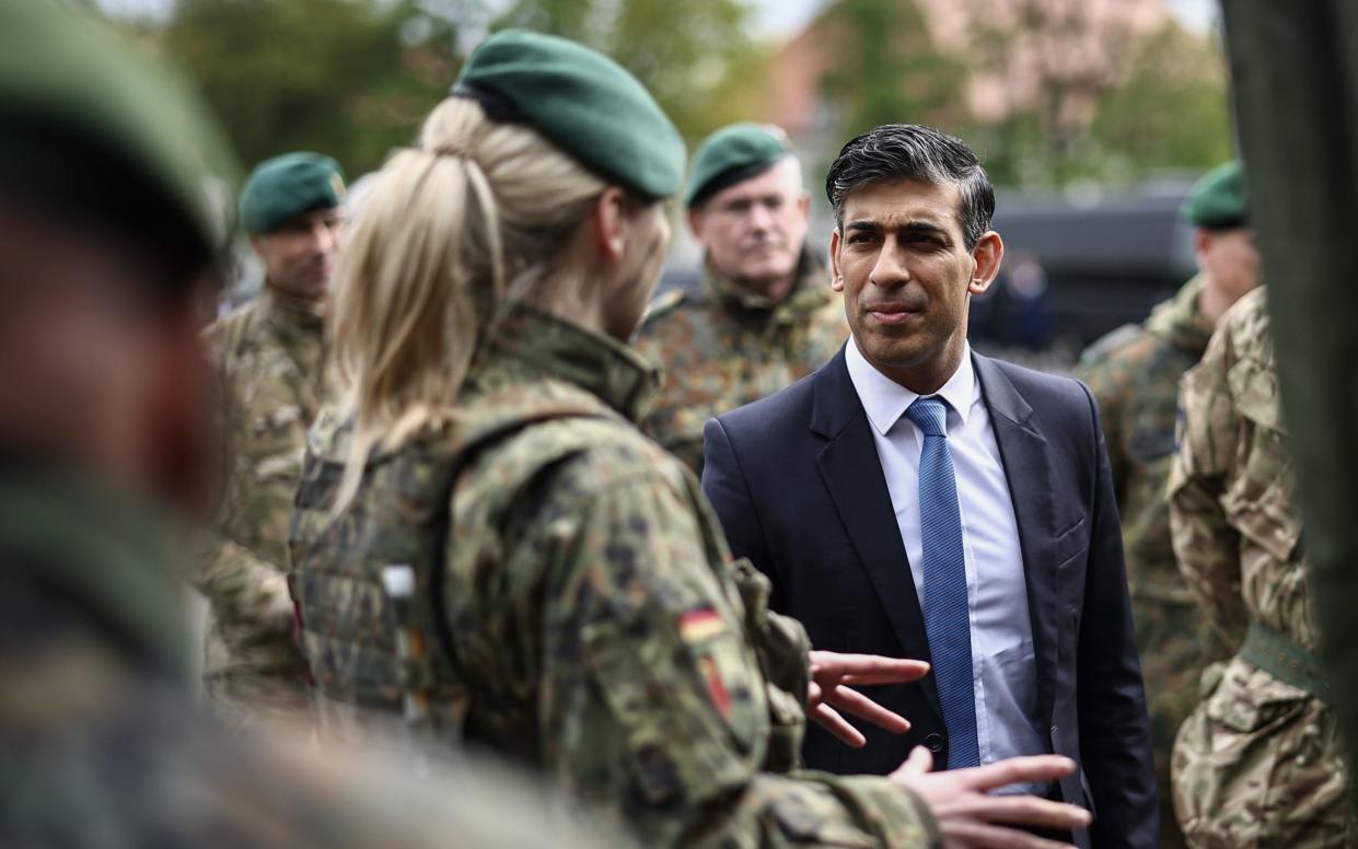 Prime Minister Rishi Sunak speaks with military personnel