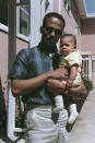 In this April 1965 photo provided by the Kamala Harris campaign, Donald Harris holds his daughter, Kamala. (Kamala Harris campaign via AP)