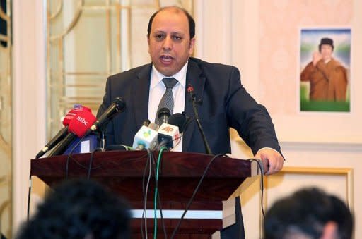 Libyan vice-foreign minister Khaled Kaaim speaks tells the press that France's recognition of Libya's opposition national council is "illegitimate and illegal." France's Sarkozy and Britain's Cameron declare: "Kadhafi and his clique must go."