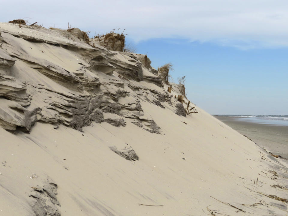 A badly eroded beach in North Wildwood, N.J. is shown on Feb. 24, 2023. The state of New Jersey is threatening additional penalties beyond the $12 million in fines it has already imposed on North Wildwood for carrying out unauthorized beach work.(AP Photo/Wayne Parry)