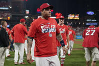 St. Louis Cardinals catcher Yadier Molina celebrates with teammates after defeating the Milwaukee Brewers in a baseball game to clinch a playoff spot Tuesday, Sept. 28, 2021, in St. Louis. (AP Photo/Jeff Roberson)