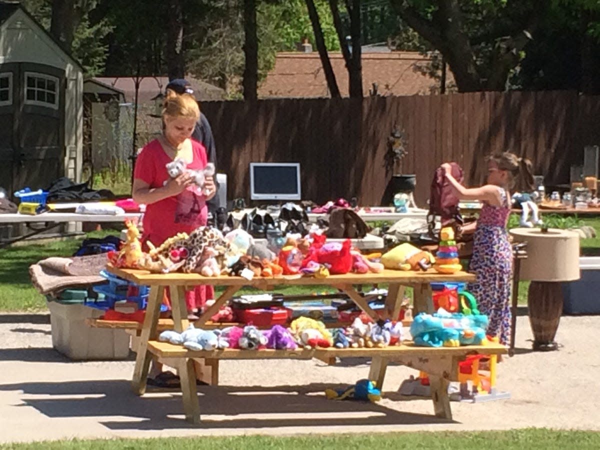 People shop during the annual Garage Sales Across The Breezeway event.