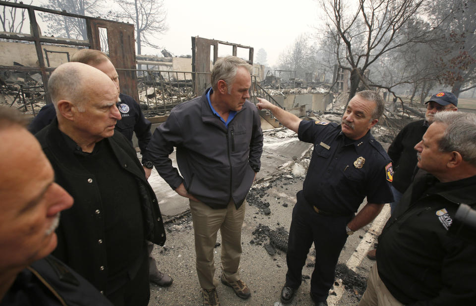 Ryan Zinke tours fire-ravaged Paradise, California, in November. (Photo: ASSOCIATED PRESS)