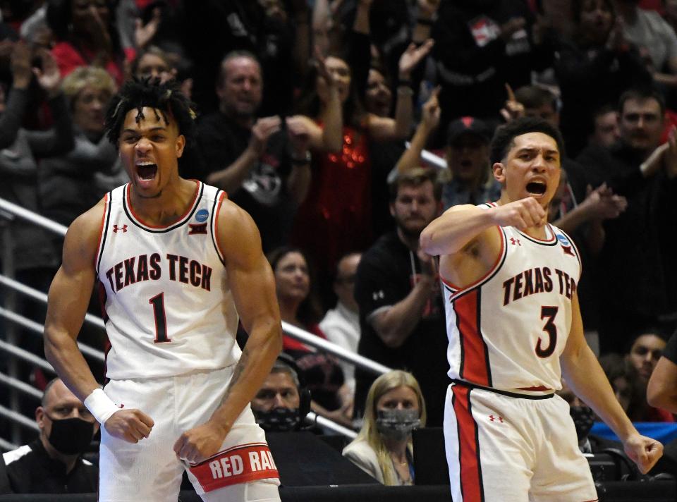 Texas Tech's Terrence Shannon, Jr. (1), left, and Texas Tech's Clarence Nadolny (3) react to a score against Notre Dame in the NCAA tournament's second round game, Sunday, March 20, 2022, at Viejas Arena in San Diego, California.