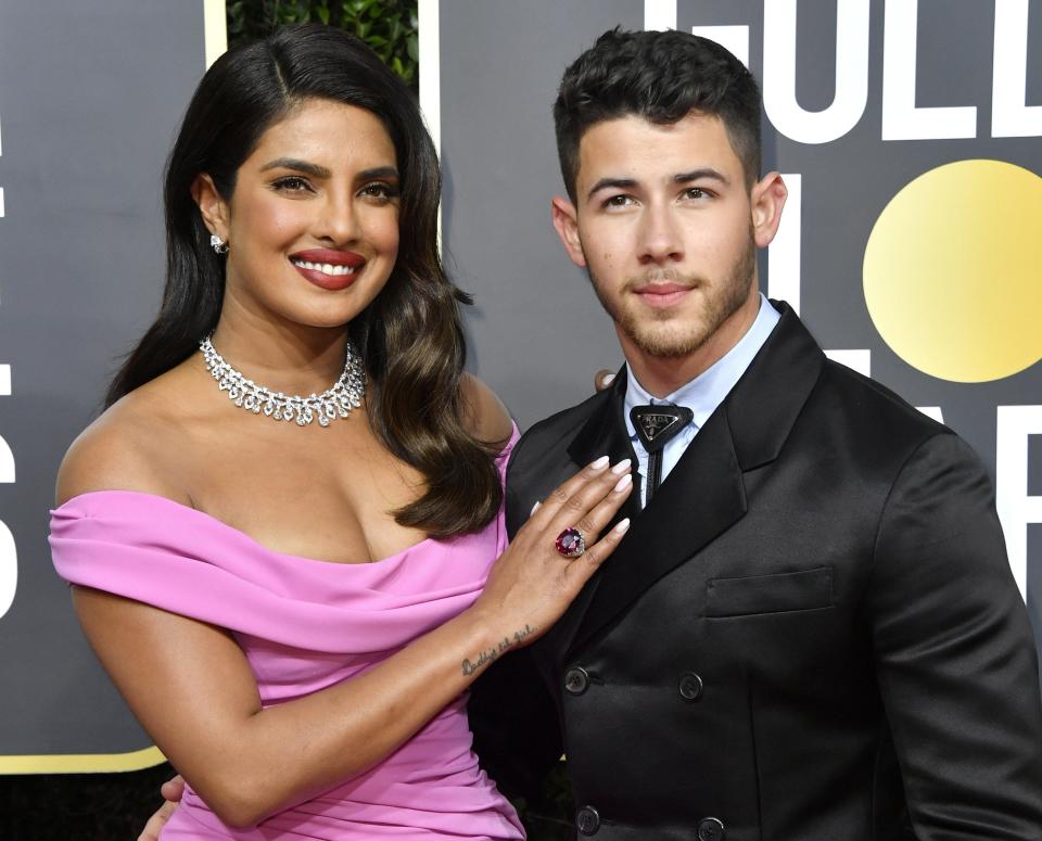 Nick and Priyanka pose together at an event