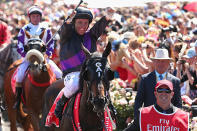 <p>Jockey Damien Oliver celebrates atop Fiorente, after winning the Melbourne Cup. It was his third winning ride in the great event. Fiorente was trained by Gai Waterhouse and was her first winner ever in the Melbourne Cup.</p>