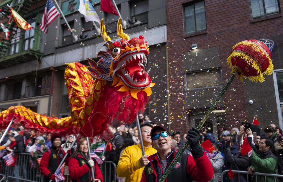 Revelers participate during the Lunar New Year parade in Chinatown in New York, Sunday, Feb. 9, 2020. (AP Photo/Craig Ruttle)