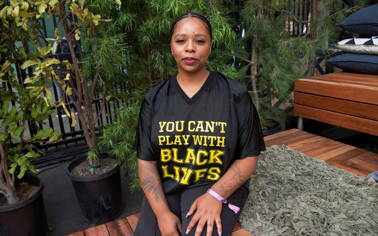 Patrisse Cullors poses for a photo - Amy Harris /Invision/AP