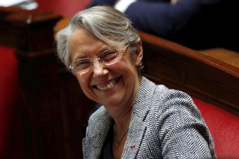 FILE - French Minister for the Ecological and Inclusive Transition Elisabeth Borne smiles during the government session at the National Assembly as France softens its strict lockdown rules during the outbreak of the coronavirus disease (COVID-19) Tuesday, May 12, 2020 in Paris. France's President Emmanuel Macron appointed Elisabeth Borne as the country's new prime minister Monday, May 6, 2022. (Gonzalo Fuentes/Pool via AP, File)