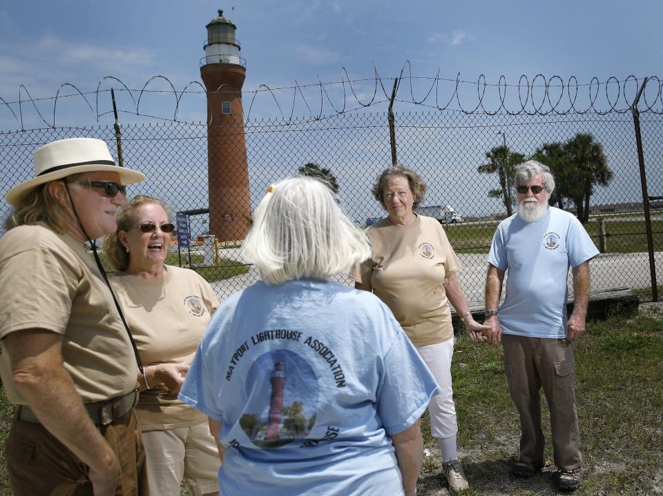 Members of the Mayport Lighthouse Association gather outside the historic St. Johns River Lighthouse, built in 1859. From left to right: Dan Hogan, the organization's president; Cindy Cox, vice president Beverly Oakes (from behind), secretary Valerie Bennett and John Ruff.