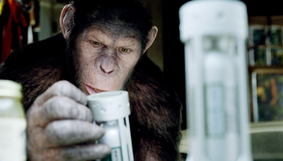 Andy Serkis as an ape examining test tubes in "Rise of the Planet of the Apes"