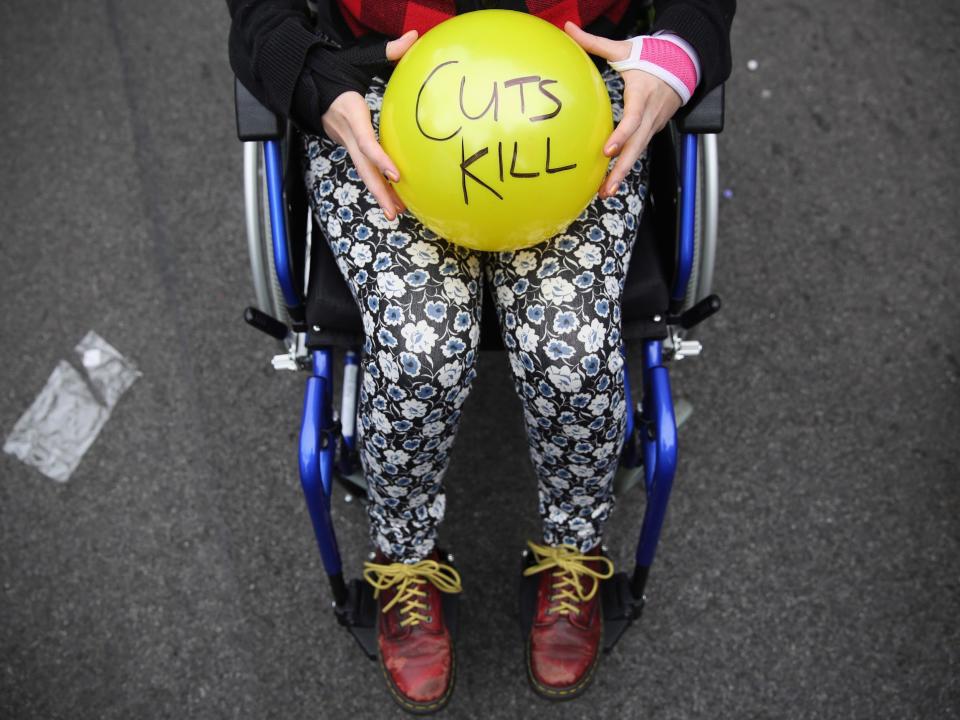 Anti-austerity protesters prepare to throw balls towards Downing Street in protest against the 2015 budget: Getty Images