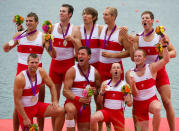 Canada's men's eight rowing team members celebrate their silver medal at Eton Dorney during the 2012 Summer Olympics in Dorney, England on Wednesday, August 1, 2012. THE CANADIAN PRESS/Sean Kilpatrick