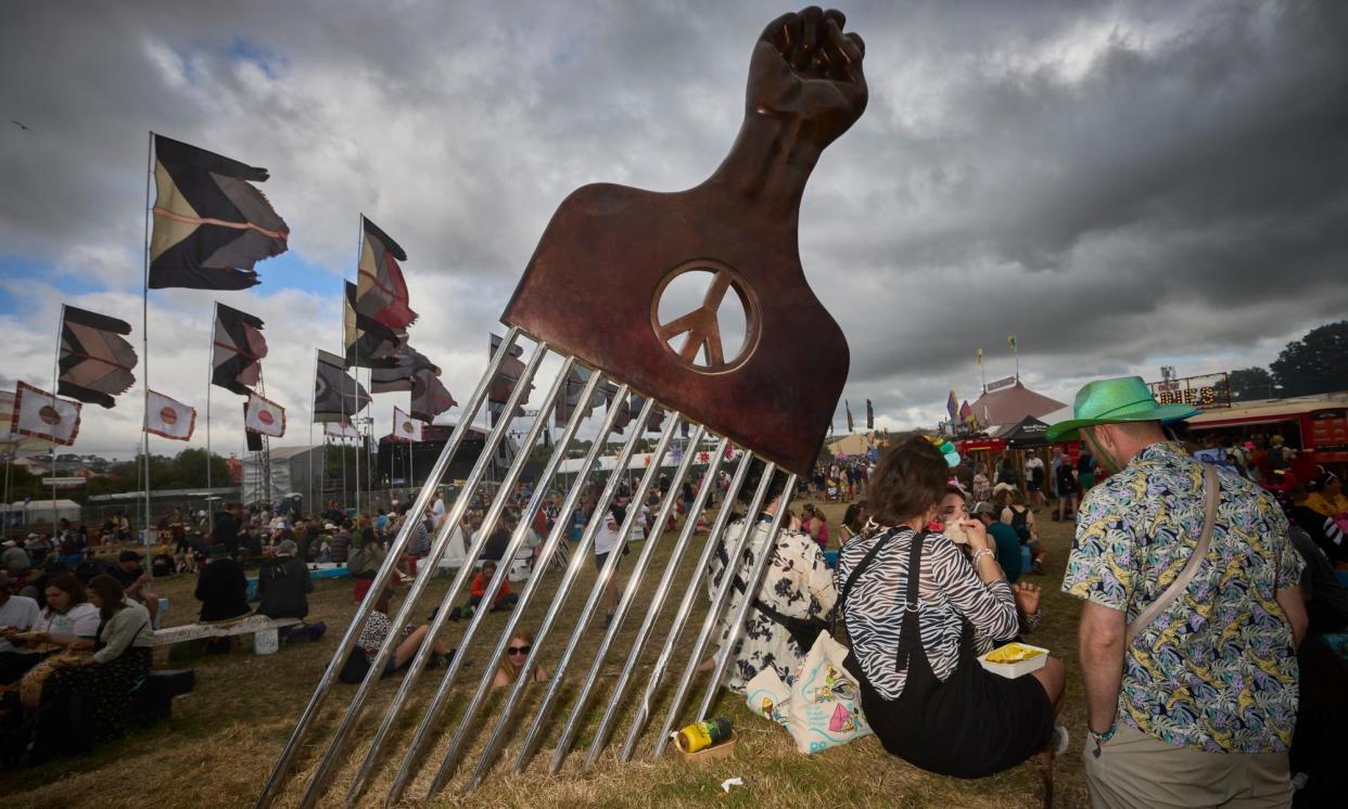 <span>A sculpture of an Afro comb in the West Holts field at Glastonbury.</span><span>Photograph: David Levene/The Guardian</span>