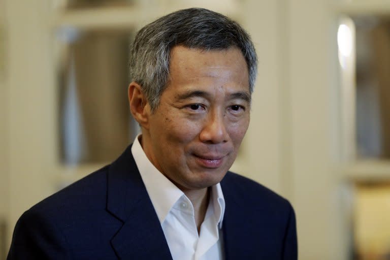 Singapore's Prime Minister Lee Hsien Loong, pictured walks to a breakfast with US Secretary of at Istana, or Presidential Palace, in Singapore, on November 17, 2012. City-state's opposition parties urged Lee on Thursday to call a by-election after the parliamentary Speaker abruptly resigned due to an extramarital affair