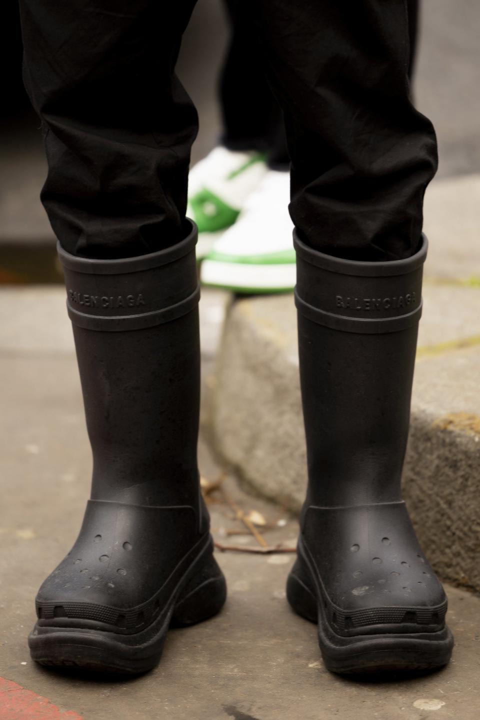 A guest wears Crocs x Balenciaga at Paris Men's Fashion Week, January 2023 (Launchmetrics)