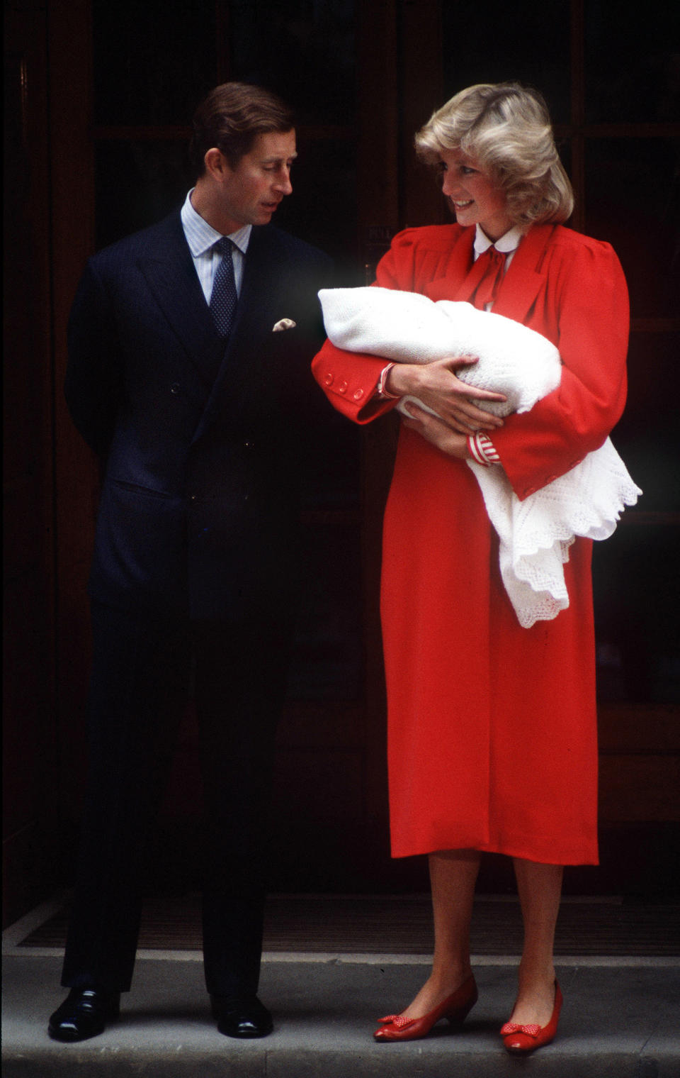 Princess Diana wore a similar red dress when she debuted Prince Harry in 1984.<em> (Getty Images)</em>