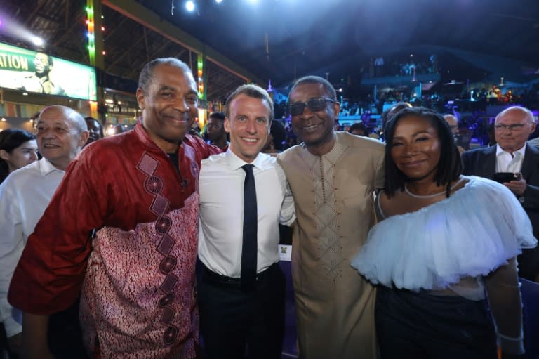 Musician Femi Kuti, left, is seen here posing recently in Lagos next to French president Emmanuel Macron and Senegalese singer Youssou N'dour (second right)