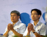 Hougang MP Png Eng Huat and NCMP Gerald Giam applaud the speeches of one of their fellow speakers. (Yahoo! photo)