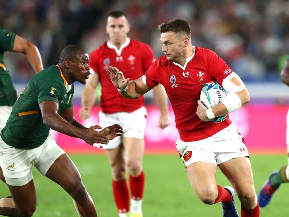 Dan Biggar of Wales (R) fends Makazole Mapimpi of South Africa: Getty Images