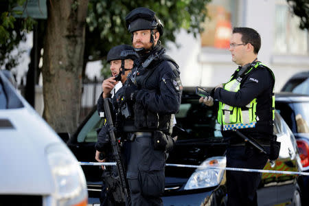 Armed policemen stand by cordon outside Parsons Green tube station in London, Britain September 15, 2017. REUTERS/Kevin Coombs