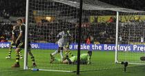 Stoke City's goalkeeper Asmir Begovic (C) is beaten by a shot from Swansea City's Nathan Dyer (unseen) during their English Premier League soccer match at the Liberty Stadium in Swansea, Wales, November 10, 2013.