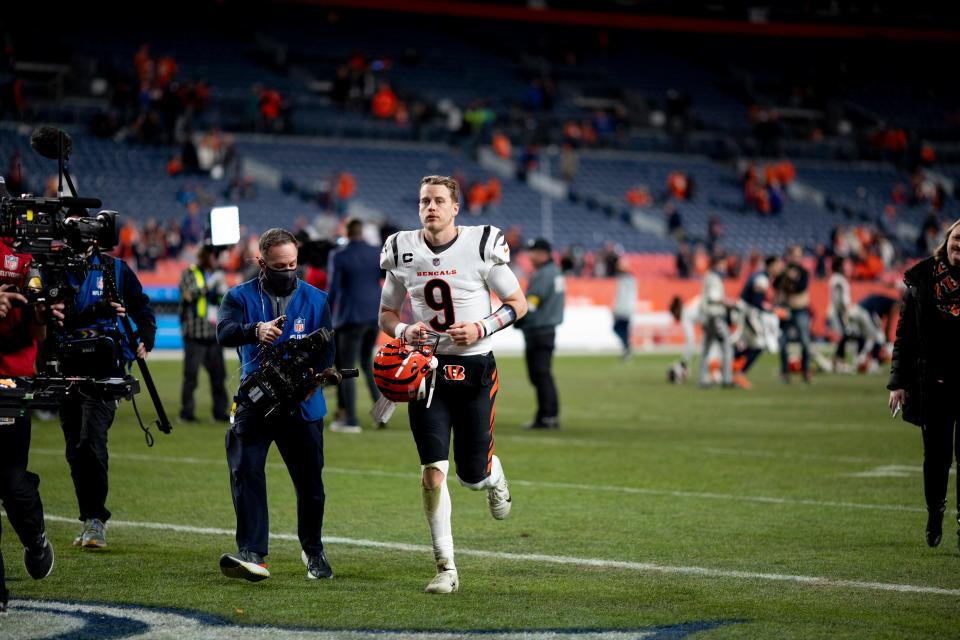 Cincinnati Bengals quarterback Joe Burrow (9) runs off the field after the NFL football game on Sunday, Dec. 19, 2021, at Empower Field in Denver. Cincinnati defeated Denver 15-10.