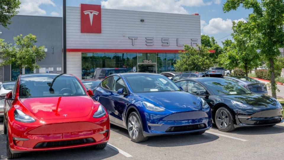 Tesla Model Y vehicles sit on the lot for sale at a Tesla car dealership on May 31, 2023 in Austin, Texas. 