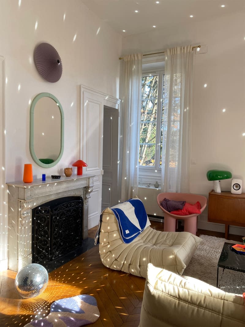 Light reflected around eclectic living room.