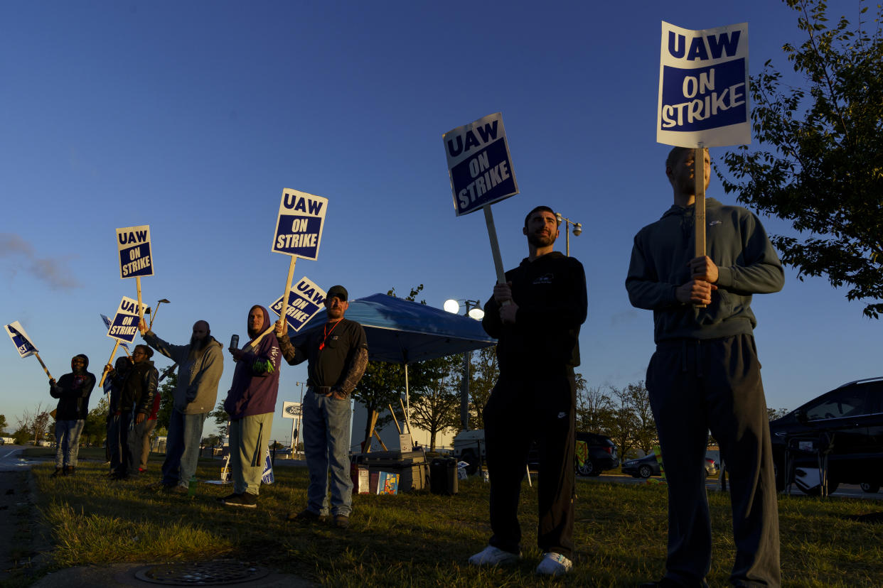 Factory workers and UAW union members form a picket line outside a Ford Motor Co. plant on Oct. 14 in Louisville, Ky. 