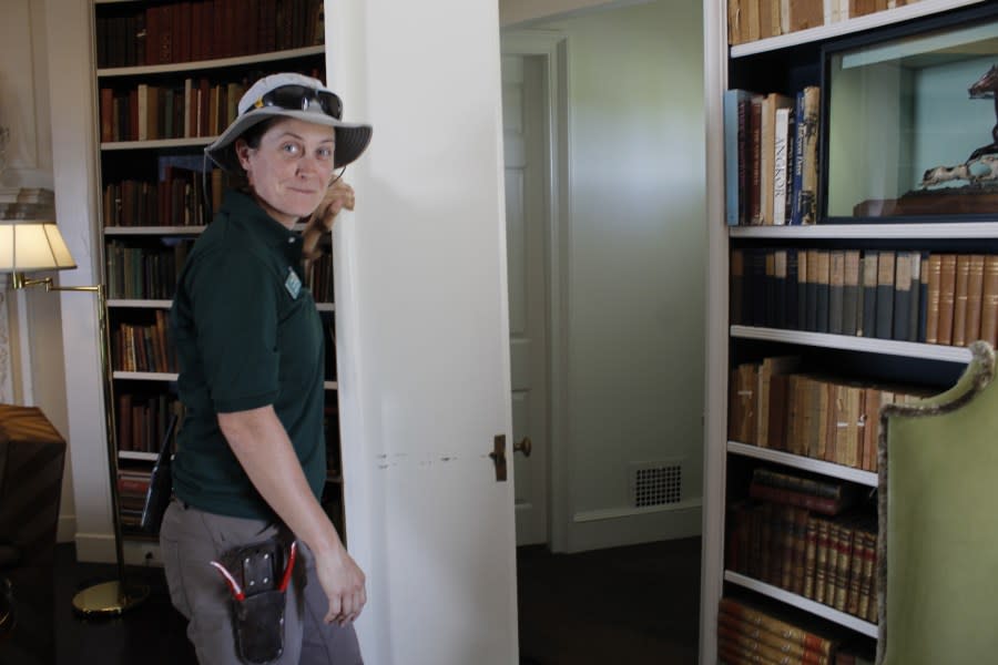Abby Evans shows the secret door in the library