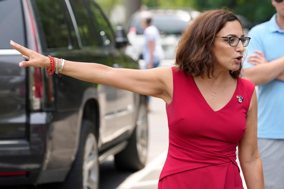 Former state Rep. Katie Arrington speaks with reporters outside a polling place during the state's primary election, on Tuesday, June 14, 2022, in Summerville, S.C. Arrington, who is backed in the 1st District race by former President Donald Trump, told The Associated Press she felt she would win the GOP primary election over incumbent U.S. Rep. Nancy Mace with "53 percent." (AP Photo/Meg Kinnard)