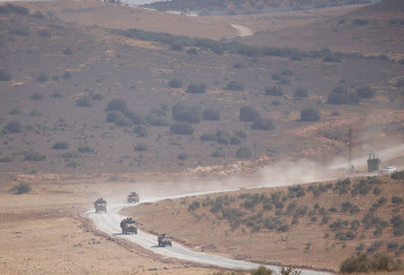 Turkish armoured military vehicles patrol on the Turkish-Syrian border line in Reyhanli, Hatay province, Turkey, October 8, 2017. REUTERS/Osman Orsal