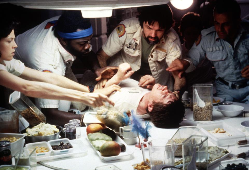 Kane (John Hurt, on table) comes to a horrific end as Ripley (Sigourney Weaver), Parker (Yaphet Kotto), Dallas (Tom Skerritt) and Ash (Ian Holm) try to help in the 1979 sci-fi thriller "Alien."