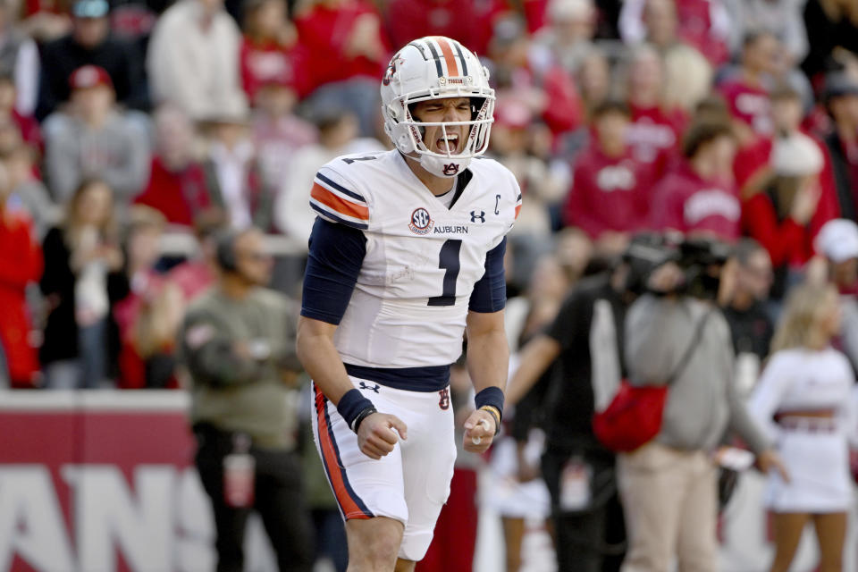 Auburn quarterback Payton Thorne (1) celebrates after running for a touchdown against Arkansas during the first half of an NCAA college football game Saturday, Nov. 11, 2023, in Fayetteville, Ark. (AP Photo/Michael Woods)