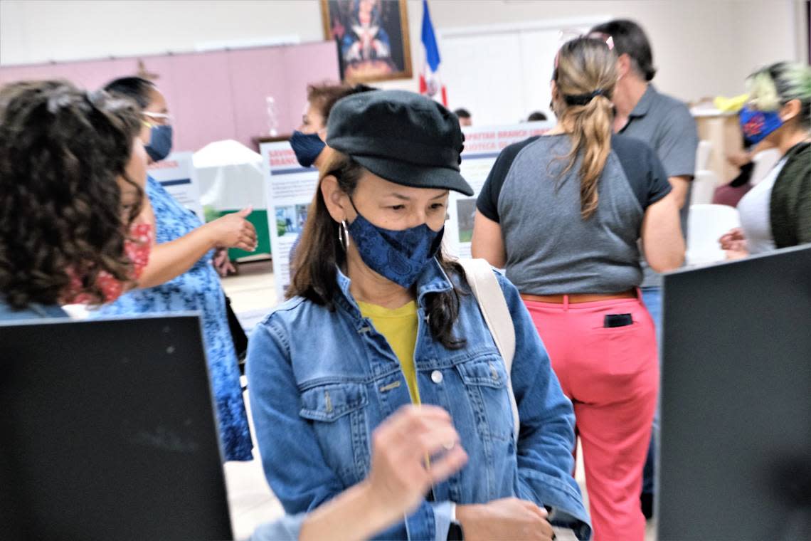 An Allapattah resident looks at the signs displaying information on the General Services Administration lot at a Public Land for Public Good community outreach event last summer.