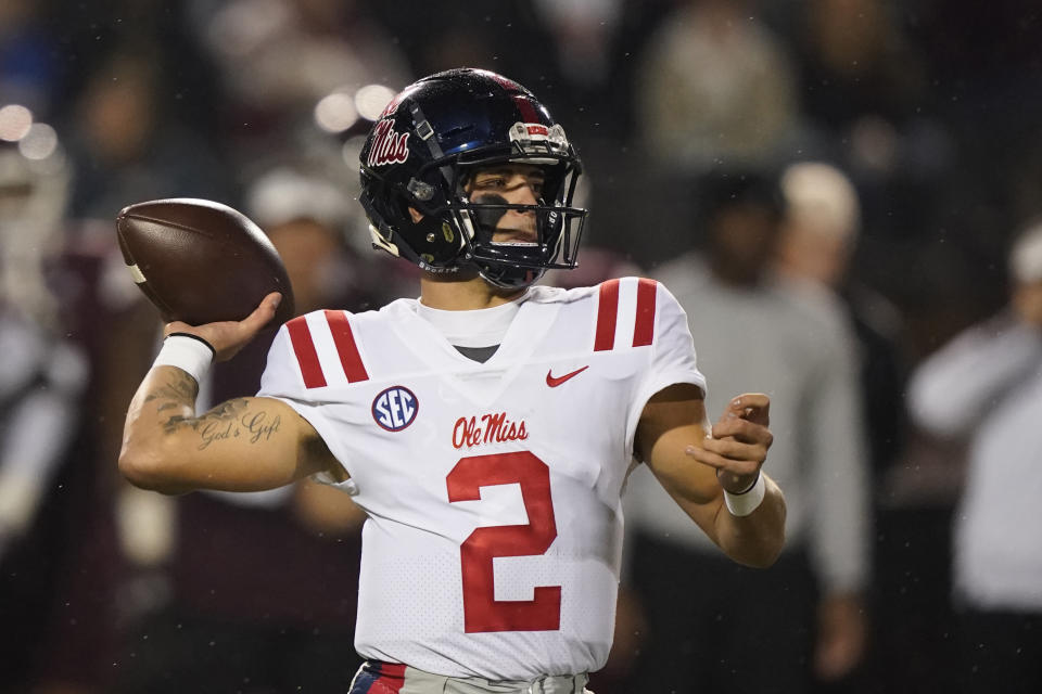 Mississippi quarterback Matt Corral (2) passes against Mississippi State during the first half of an NCAA college football game, Thursday, Nov. 25, 2021, in Starkville, Miss. (AP Photo/Rogelio V. Solis)
