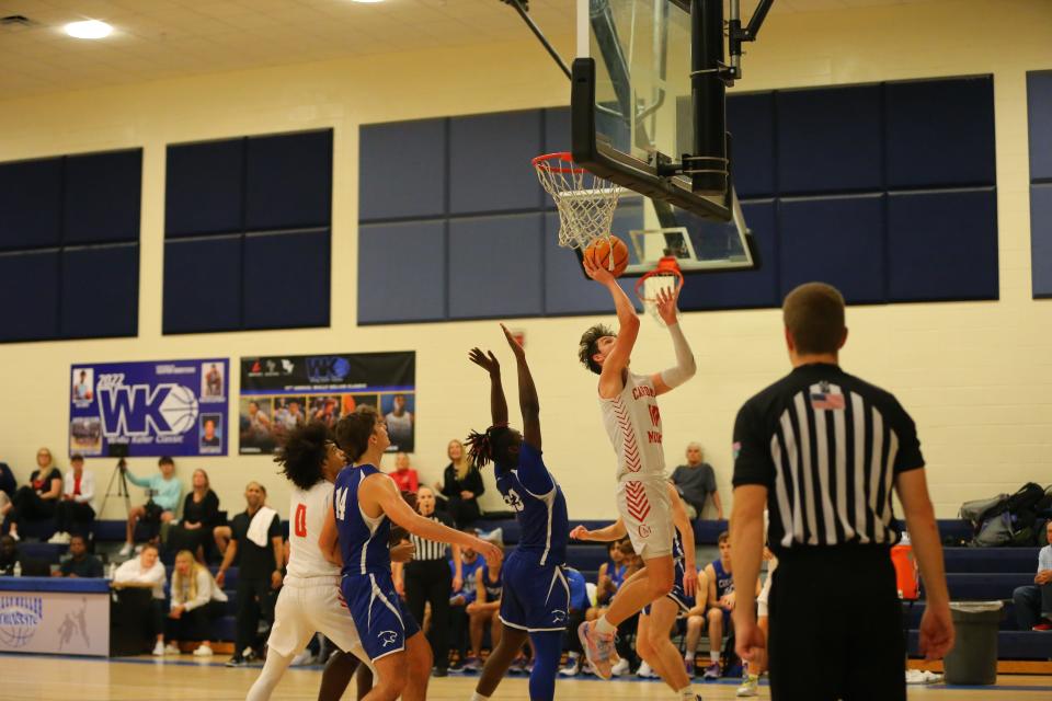 Cardinal Mooney's Kevin O'Donoghue goes up for two points in the Cougars' game against Barron Collier in the 17th Annual Wally Keller Classic on Saturday at Charlotte High.