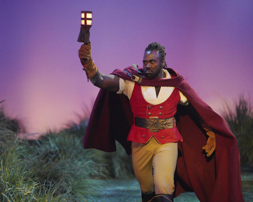 This image released by ABC shows Joshua Henry as Gaston in "Beauty and the Beast: A 30th Celebration," airing Thursday on ABC. (Christopher Willard/ABC via AP)