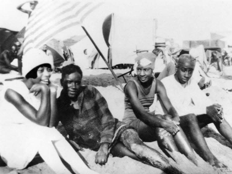 Group of beachgoers in the segregated section of Santa Monica beach known as the Ink Well, 1926
