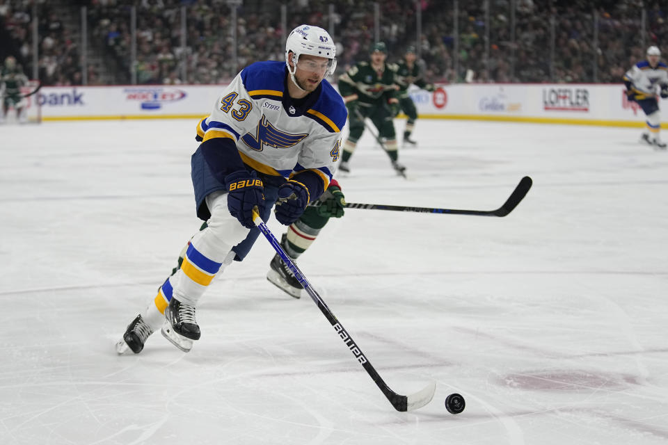 St. Louis Blues defenseman Calle Rosen skates with the puck during the first period of an NHL hockey game against the Minnesota Wild, Saturday, April 8, 2023, in St. Paul, Minn. (AP Photo/Abbie Parr)
