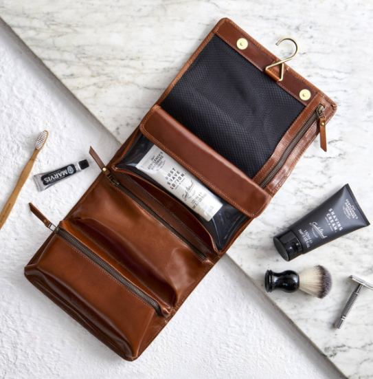 <p>This leather hanging wash bag is the perfect thing for your man to store all his grooming goodies in and is also great for travel. Source: <a rel="nofollow noopener" href="https://giftslessordinary.com/au/leather-hanging-wash-bag-006335" target="_blank" data-ylk="slk:Gifts Less Ordinary;elm:context_link;itc:0;sec:content-canvas" class="link ">Gifts Less Ordinary</a> </p>