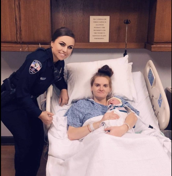 Officer Sierra Reprogal visits Bridgette Crumley and the baby she helped to deliver. (Photo: Facebook)