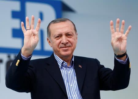 Turkish President Tayyip Erdogan greets his supporters during a ceremony in Istanbul, Turkey, March 26, 2017. REUTERS/Murad Sezer