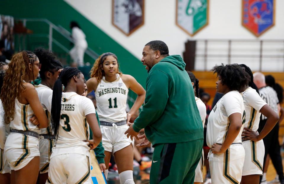 South Bend Washington girls basketball head coach Steve Reynolds talks to his team during a timeout in a game against Bolingbrook Saturday, Jan. 6, 2024, at Washington High School.