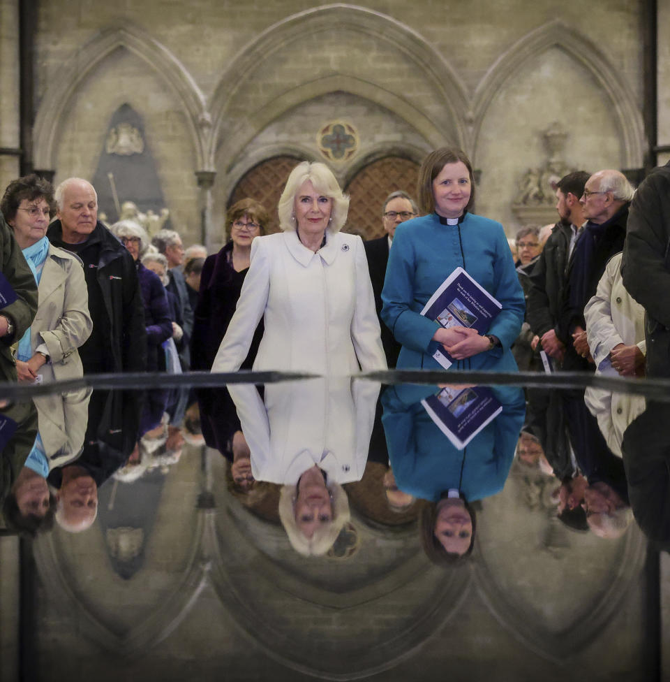 FILE - Britain's Queen Camilla takes a moment of reflection at The Salisbury font, designed by British water sculptor William Pye during a Musical Evening at Salisbury Cathedral to celebrate the work of local charities, the queen will also meet the two directors of The Band of the Grenadier Guards and the Band of The Rifles in Salisbury, England, Thursday, Feb. 8, 2024. Queen Camilla, once seen as the scourge of the House of Windsor, the woman at the heart of King Charles III’s doomed marriage to the late Princess Diana, has emerged as one of the monarchy’s most prominent emissaries. (Chris Jackson, Pool via AP, File)