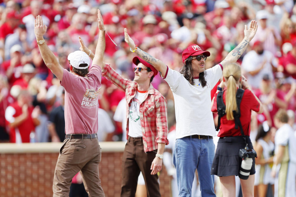 Caleb, Jared, and Nathan greet fans during a game between the Oklahoma Sooners and the UCF Knights at Gaylord Family Oklahoma Memorial Stadium on October 21, 2023 in Norman, Oklahoma. Oklahoma won 31-29. (Credit: Brian Bahr/Getty Images)