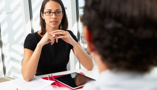 businesswoman interviewing male ...